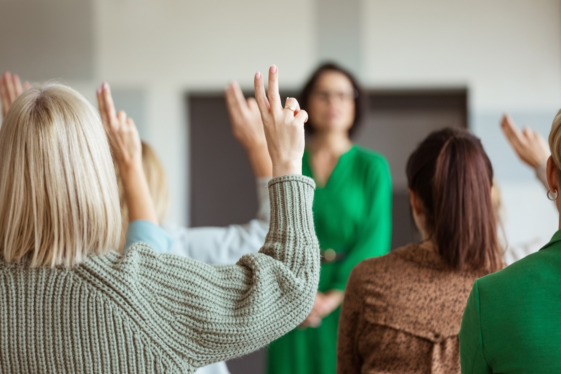 Women voting during seminar