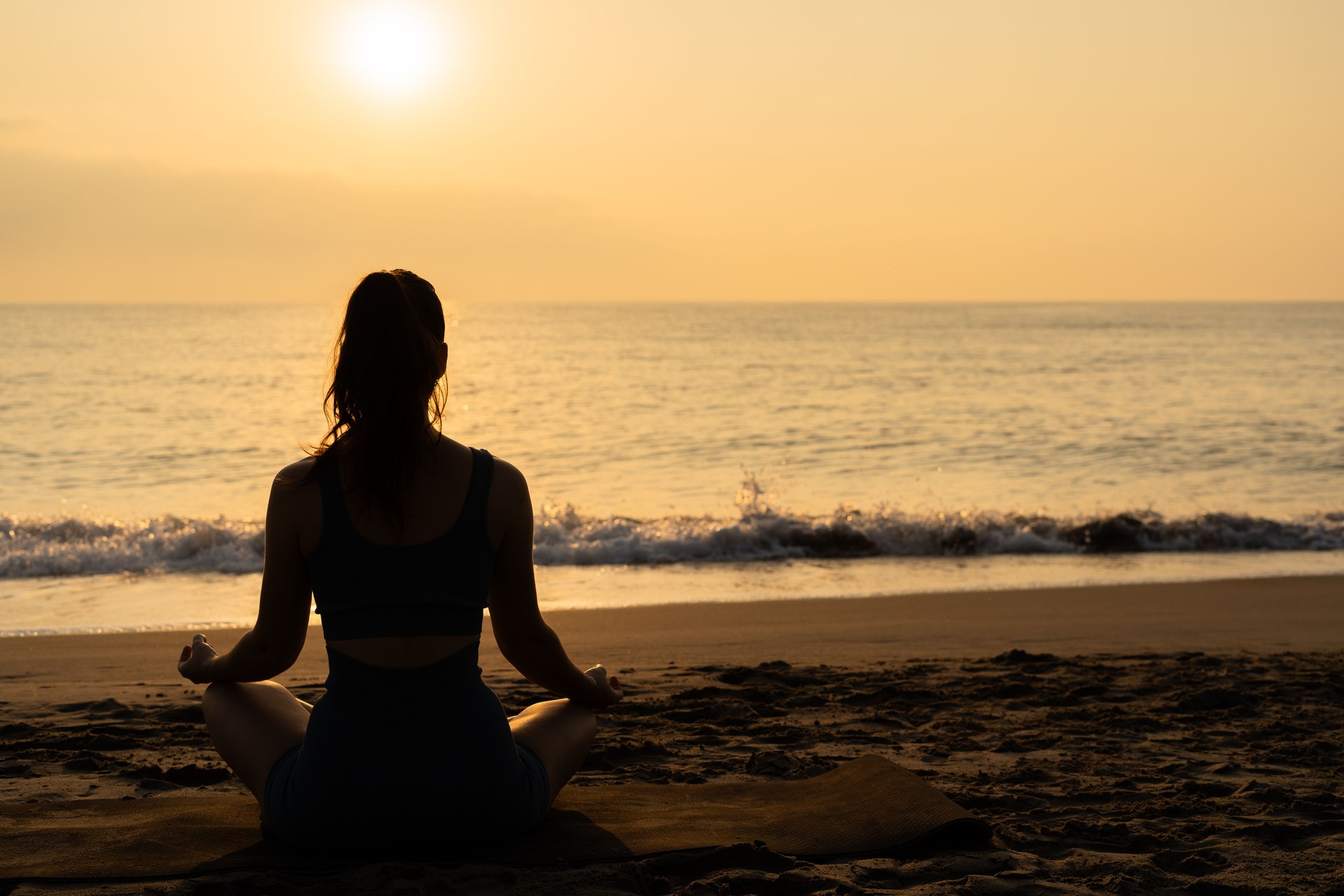 meditation and yoga on the beach.